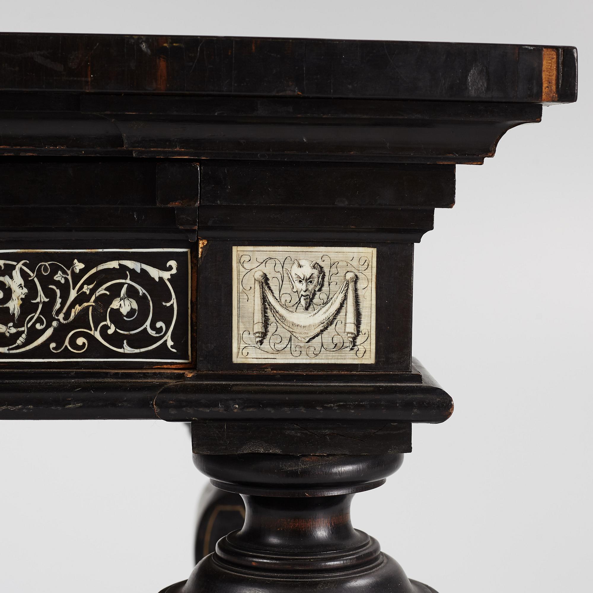 A Renaissance-style ebony, ebonized and ivory-inlaid library table, late 19th century, presumably Germany.