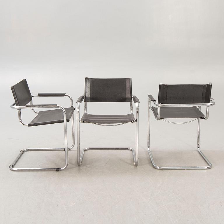 A set of five similar Italian 1970s chrome and leather armchairs.