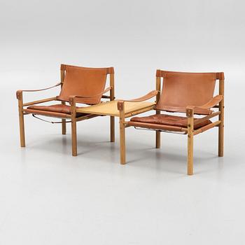 Arne Norell, fåtöljer, ett par med bordsskiva, "Sirocco", Norell Möbel AB.