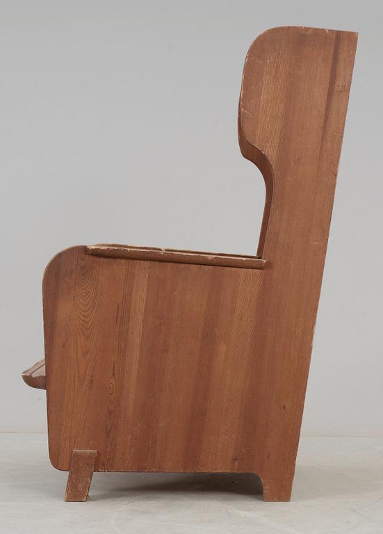 An Axel Einar Hjorth 'Lovö' stained pine armchair, Nordiska Kompaniet, Sweden 1930's.