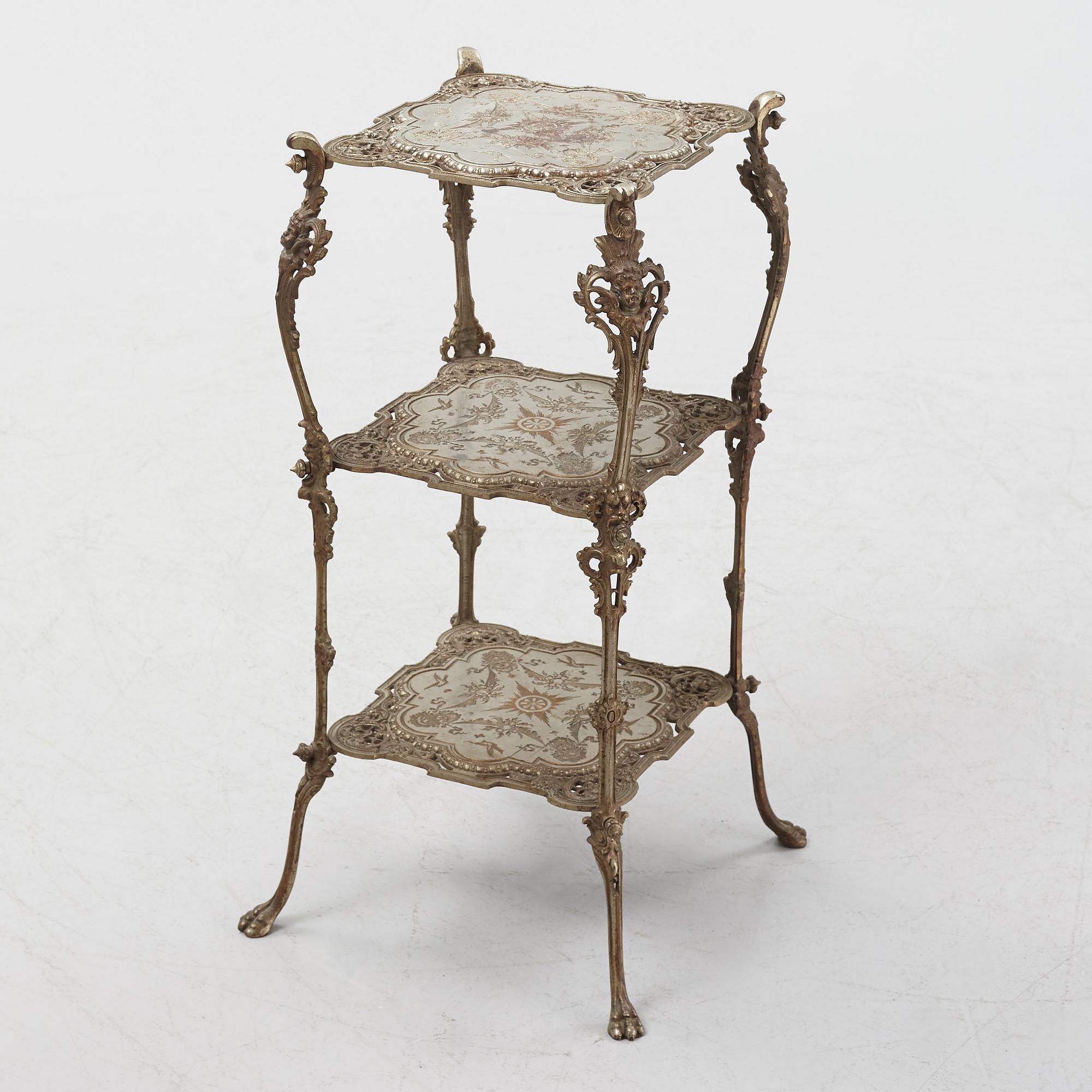 A three-tiered metal pedestal, first half of the 20th century.