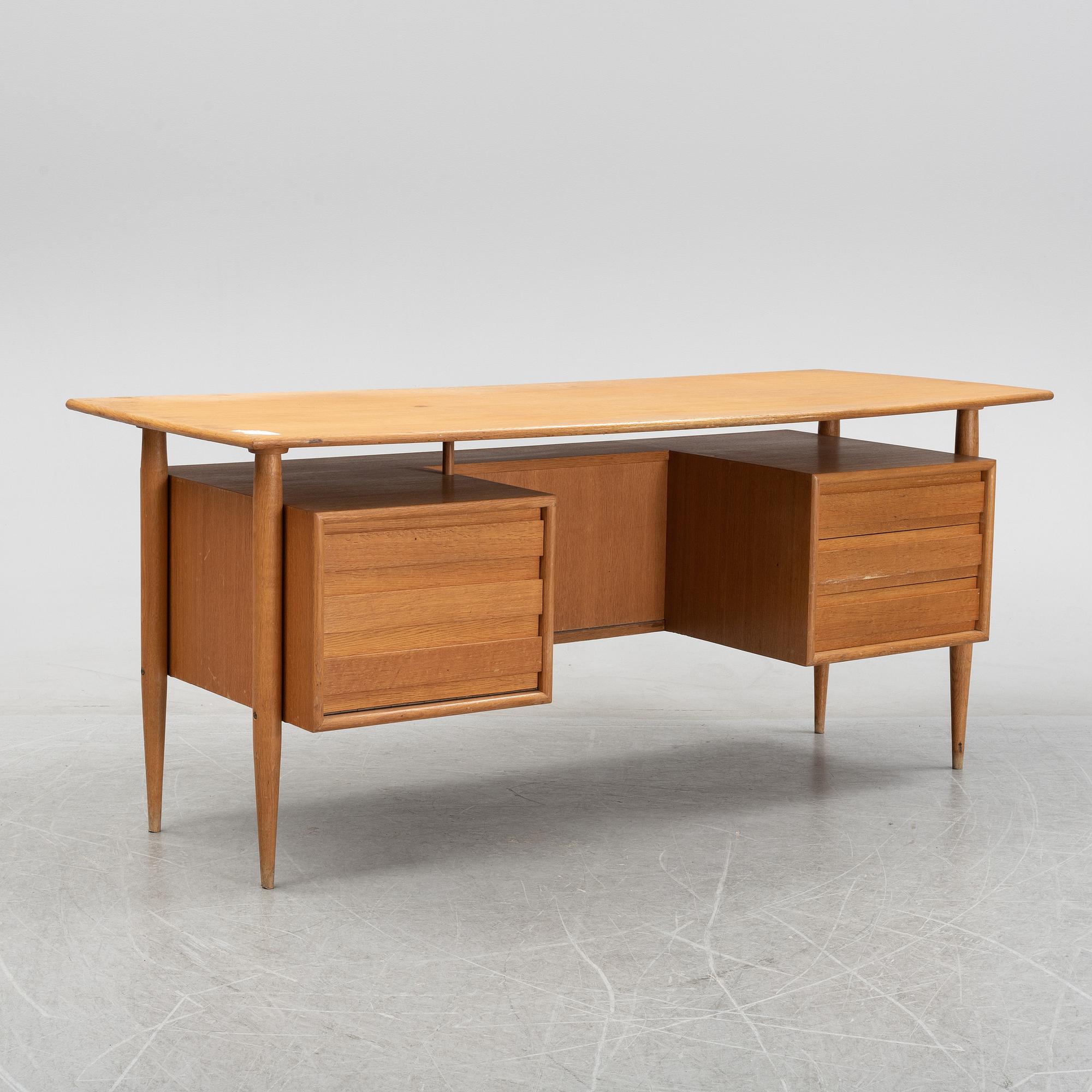 A teak veneered writing desk, 1950's/60's.