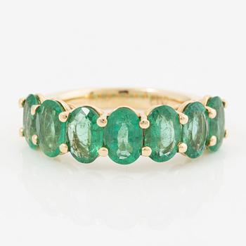 Ring, 18K gold with oval-cut emeralds.