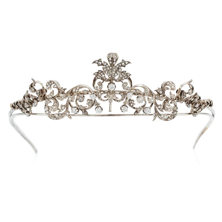 An 18K gold and silver tiara composed of scroll motifs set  with old- and rose-cut diamonds.