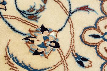 A carpet, Nain, part silk, fine 9 laa, signed, ca 327 x 210 cm.