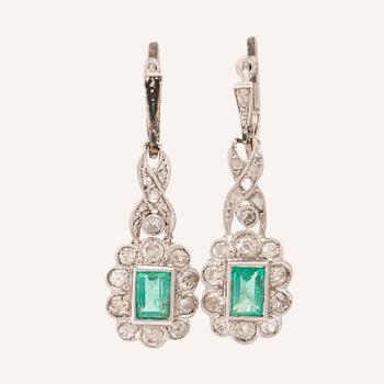 A pair of 18K white gold earrings set with baguette-cut emeralds and various cut diamonds, G. Dahlgren & Co Malmö.