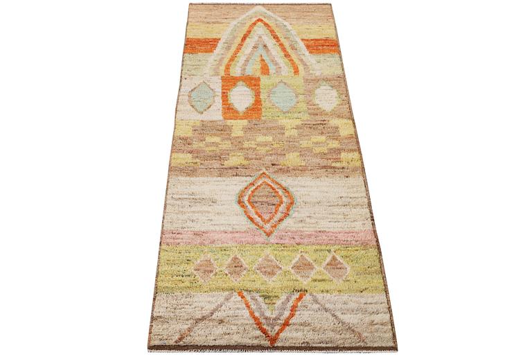 A Moroccan runner carpet, c. 304 x 84 cm.