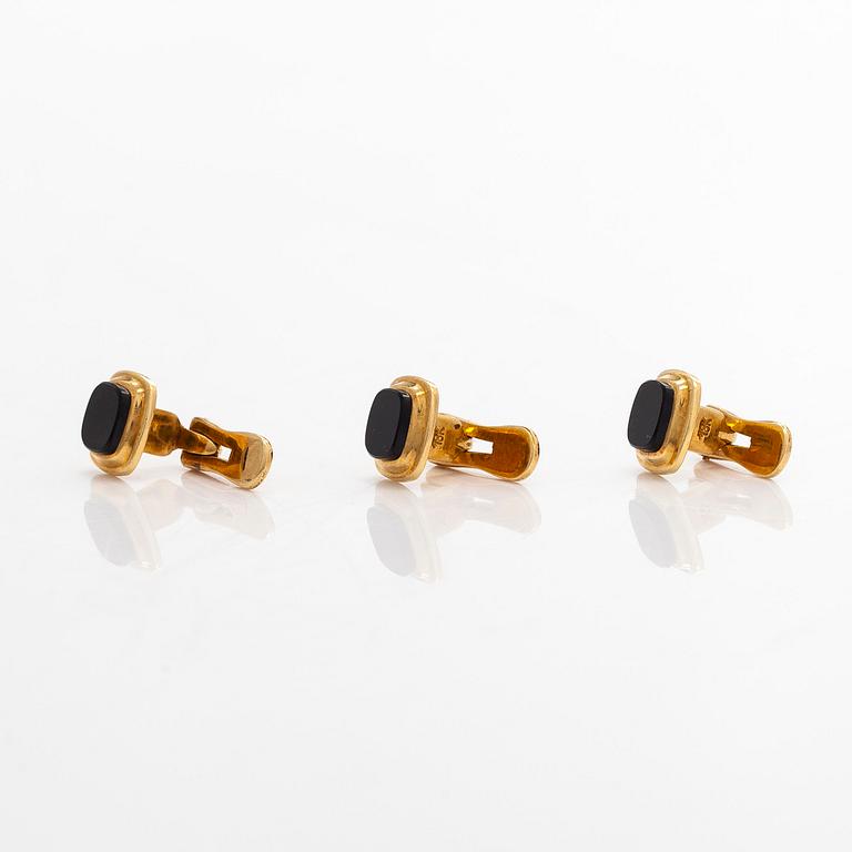 A pair of cufflinks and three shirt buttons,  18K gold and onyx.