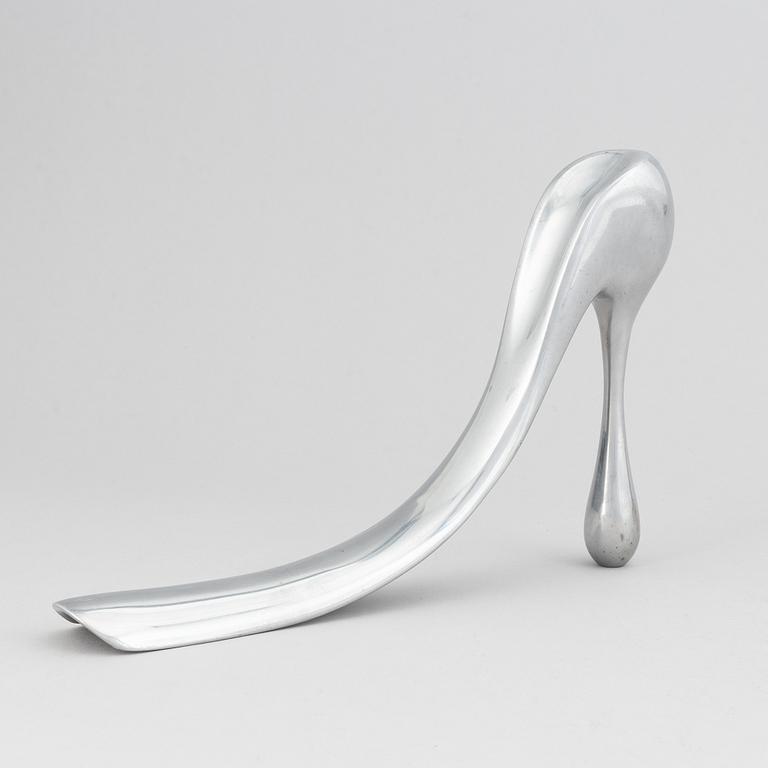 Manolo Blahnik, a metal shoe horn, 21st century.