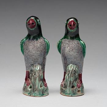 A pair of Chinese figures of parrots, late Qing dynasty.