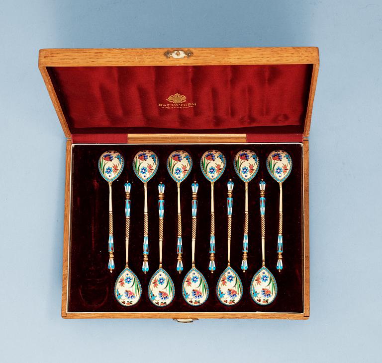 ARUSSIAN SILVER-GILT AND ENAMEL SET OF 11 TEA-SPOONS, Makers mark of Nicholai Alexeyev, Moscow 1880's.