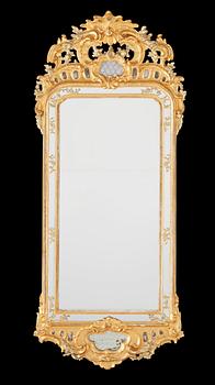 1564. A Swedish Rococo mirror dated 1771.
