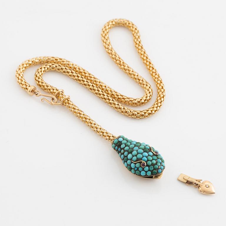 Necklace in gold in the shape of a serpent with turquoise and rubies.