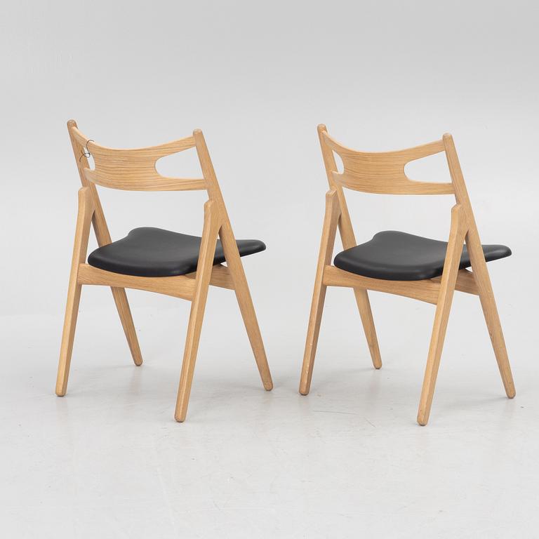 Hans J Wegner, a pair of chairs, model CH 29 "The Savbuk Chair", Carl Hansen.