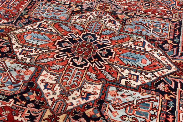 A semi-antique Heris carpet, c. 364 x 299 cm.