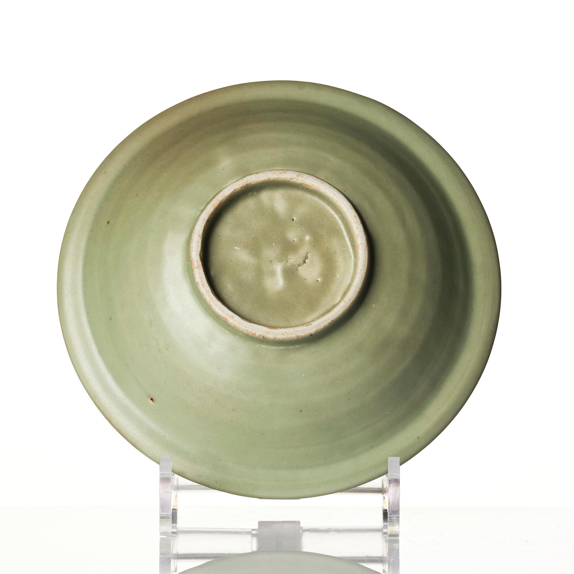 A celadon glazed double fish dish, Ming dynasty (1368-1644).