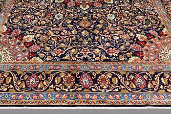 A carpet, Kashmar, signed, ca 390 x 295 cm.