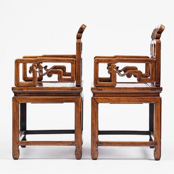 A pair of hardwood armchairs, late Qing dynasty.