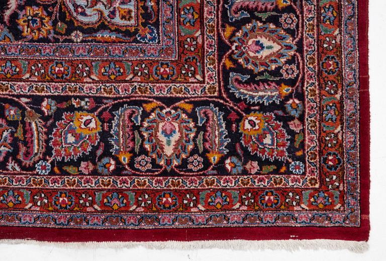 An Oriental carpet, approx. 380 x 304 cm.