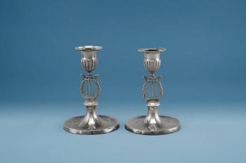 452. A PAIR OF CANDLE STICKS, silver. Gustaf Holmberg (1826-67) Turku. Led filled. Height 11 cm.