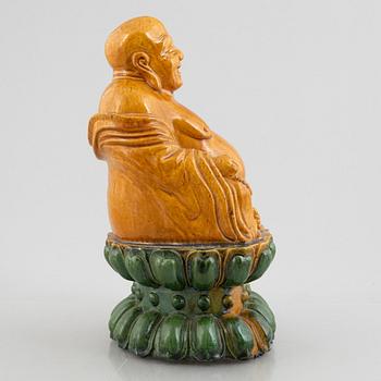 A ceramic Budai, China, 20th century.