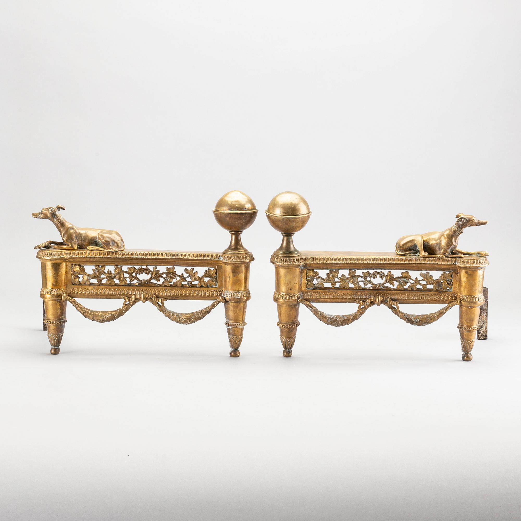 A pair of Louis XVI 18/19 century fire dogs.