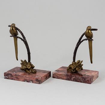 A pair of bronze and marble book-ends, first half of the 20th century.