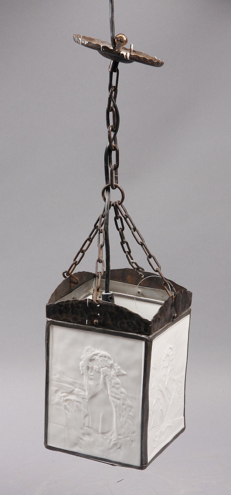 TAKLYKTA, järn, parian, 1900-talets första hälft. H 50.