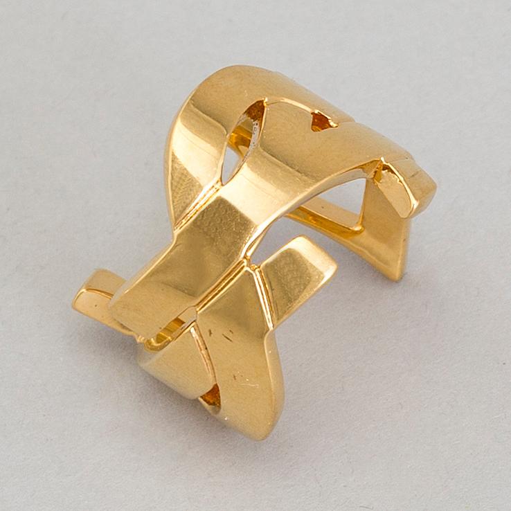 YVES SAINT LAURENT, a metal ring, size 7.