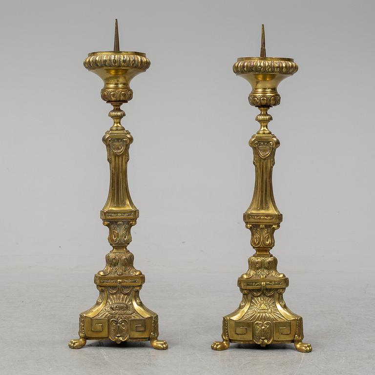 A pair of 18th century brass floor candlesticks.