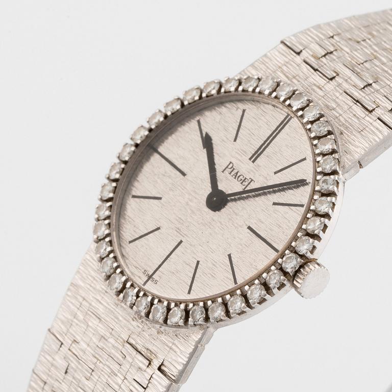 A Piaget 18K white gold wrist watch set with round brilliant-cut diamonds.