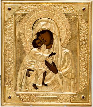 ICON, tempera on wood panel, RIZA, gilded silver and garnets, Russia latter half of 19th century.