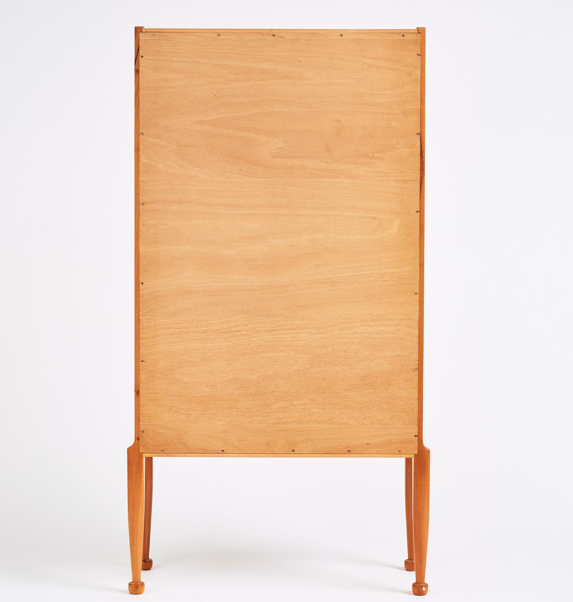Josef Frank, a walnut showcase cabinet, Svenskt Tenn, Sweden, model B 2217, probably 1950s.