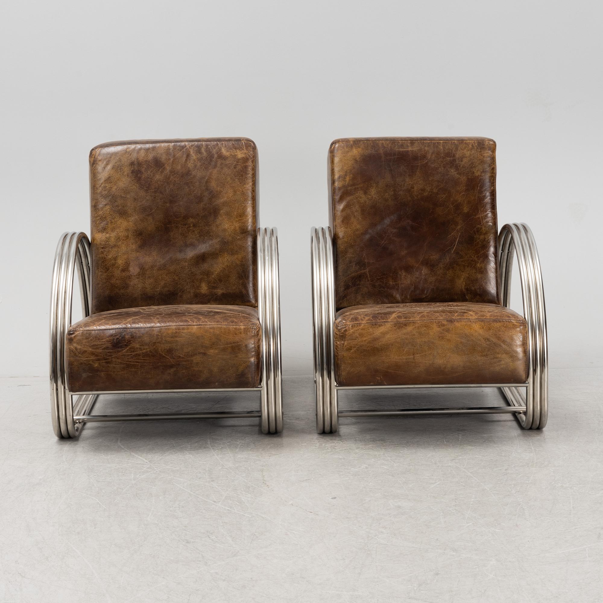 A pair of 'Hudson Street' lounge chairs from Ralph Lauren home.