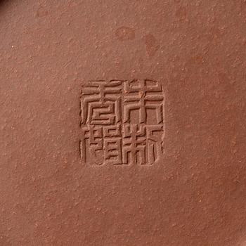 A 'calligraphy' yixing teapot, China, later part of the 1900s.