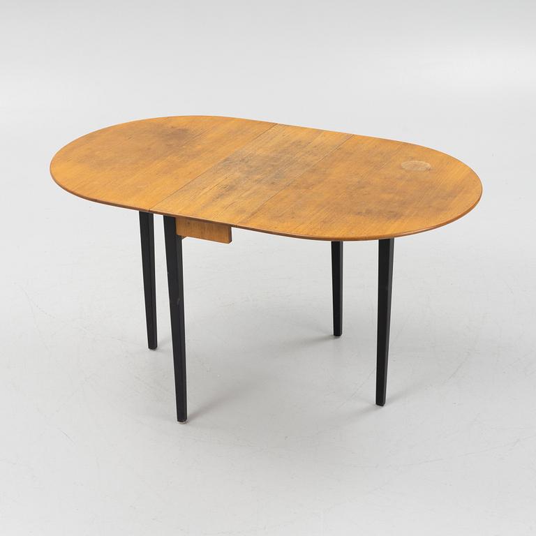 A gate-leg table, mid 20th Century.