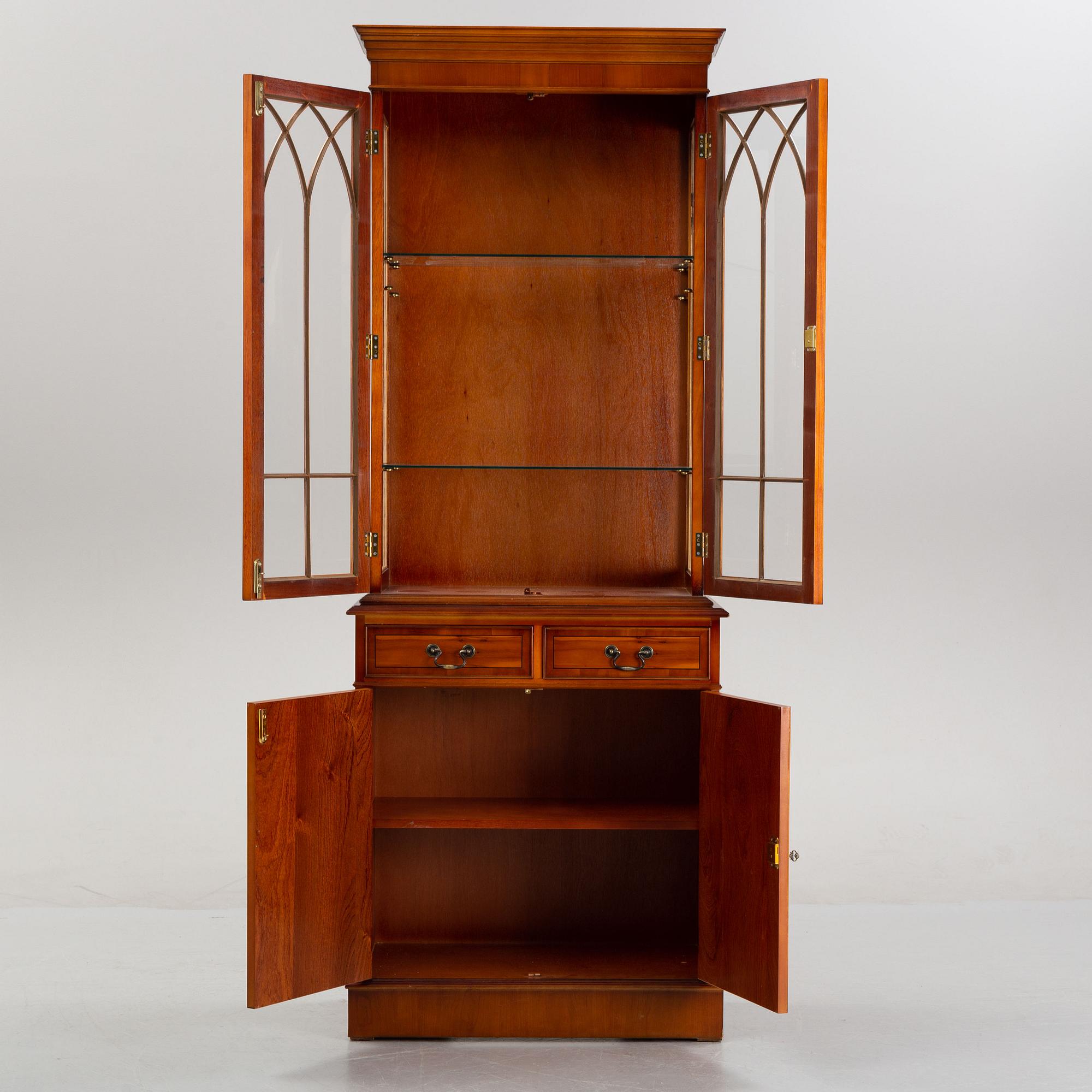 An English yew cabinet, 21st Century.
