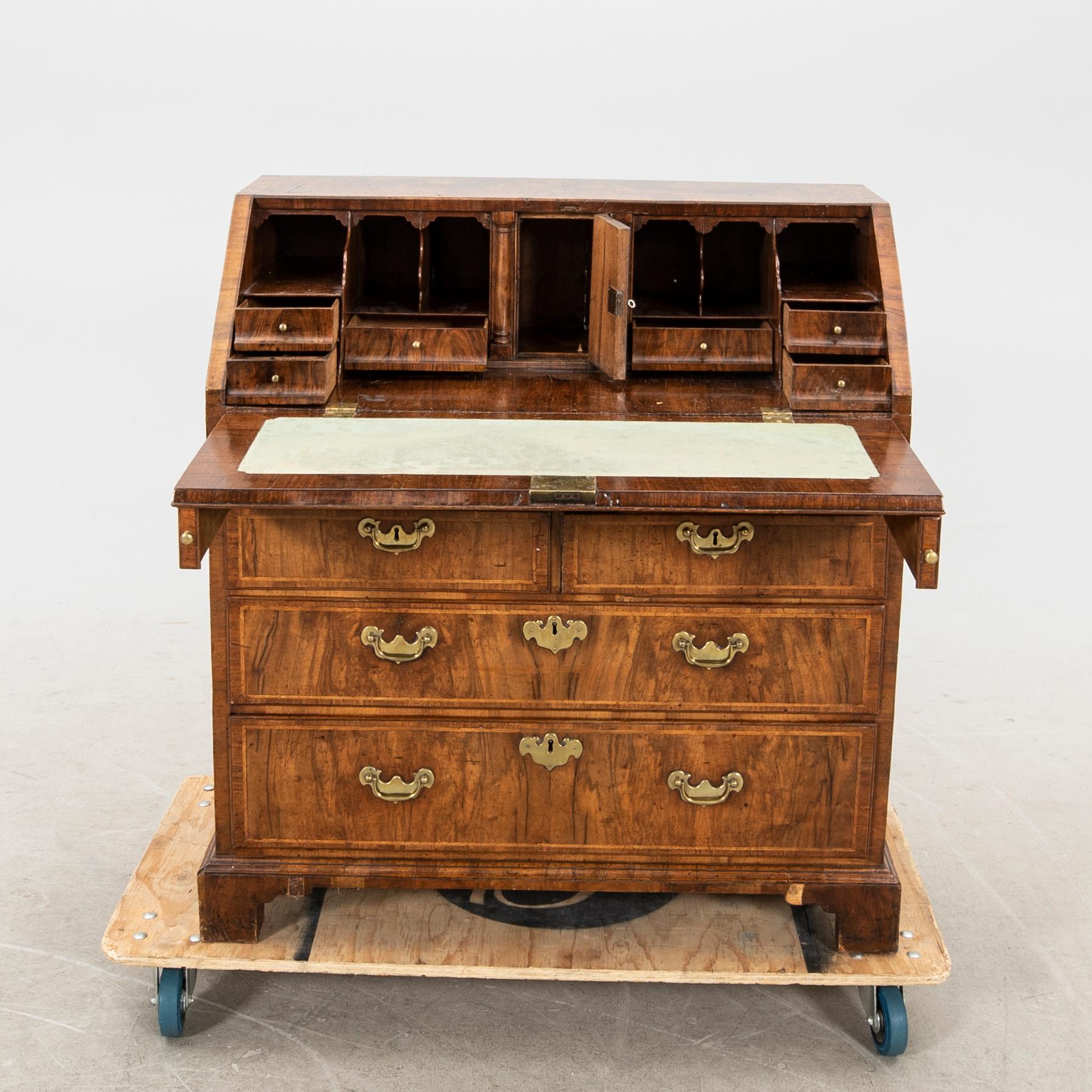 A walnut and mahogany writing bureau, mid-18th century late Baroque.