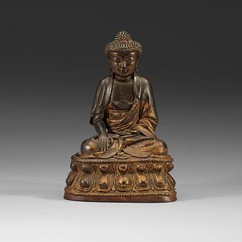212. A gilt bronze figure of Buddha Sakyamuni, Ming dynasty (1368-1644).