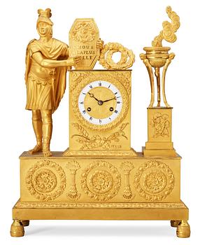 636. A French Empire early 19th century gilt bronze mantel clock.