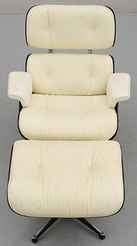 A Charles & Ray Eames white leather "Lounge Chair and ottoman", Vitra.