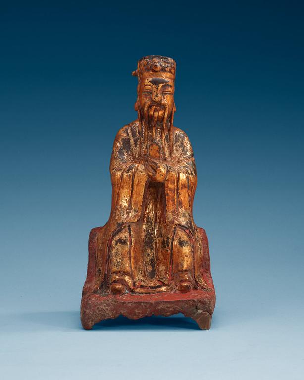 A lacquered and gilt bronze figure of a daoist dignitary, Ming dynasty (1368-1644).