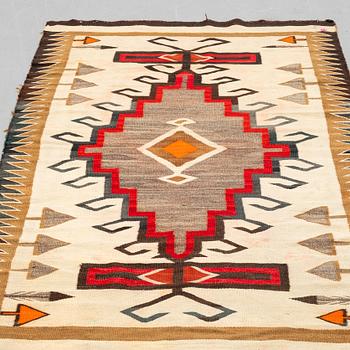 A textile, flat weave, Navaho, ca 186 x 108 cm.