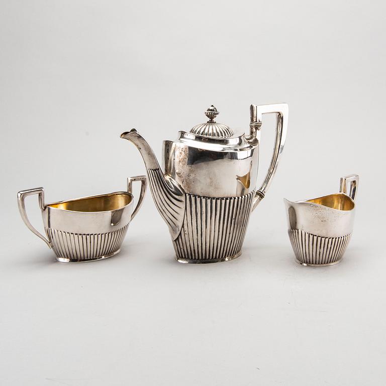 A three piece silver coffee service mark of CG Hallberg Stockholm 1916, weight 896 gram.