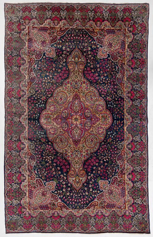 A semi-antique Kirman carpet, south Persia, c. 440 x 279 cm.