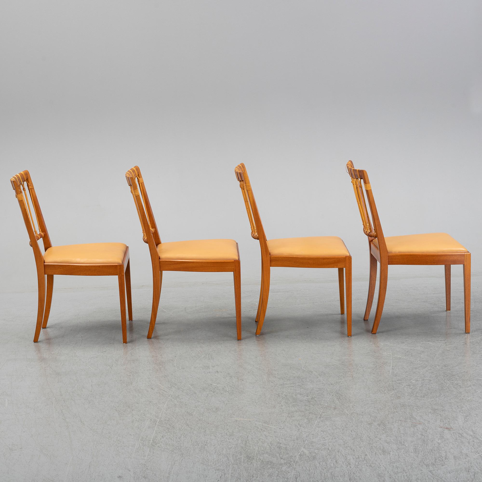 A set of four of Josef Frank mahogany and rattan dining chairs, Svenskt Tenn, Stockholm, Sweden.