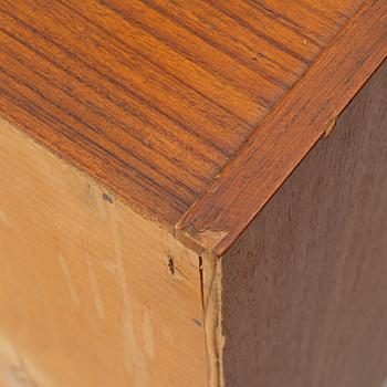 A 1950's teak veneered sideboard.