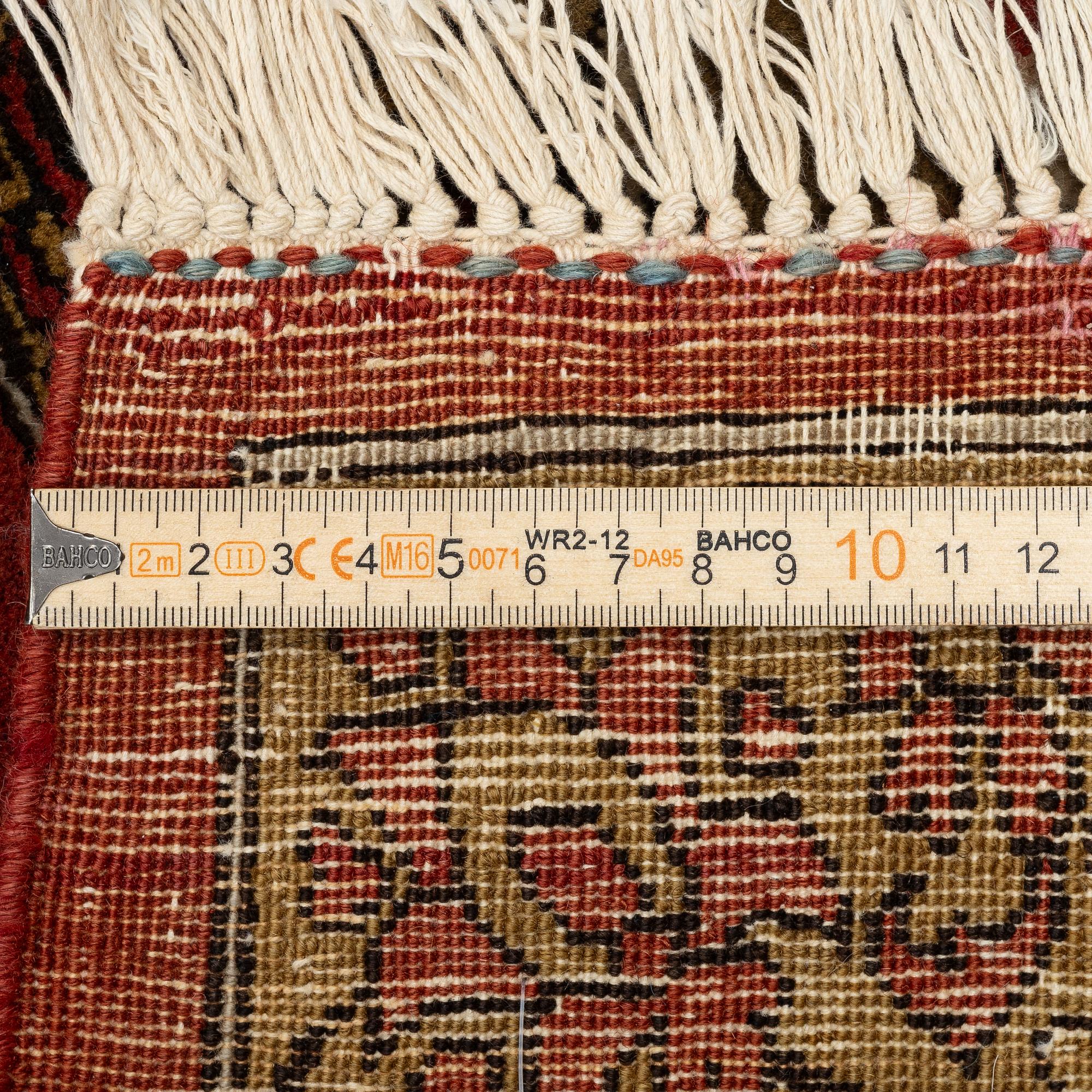 A Qum carpet, Central Persia, c. 310 x 190 cm.