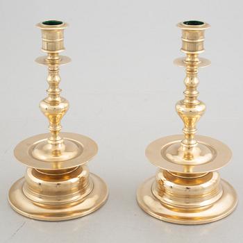 Two pairs of brass candlesticks, 19th century - early 20th century.