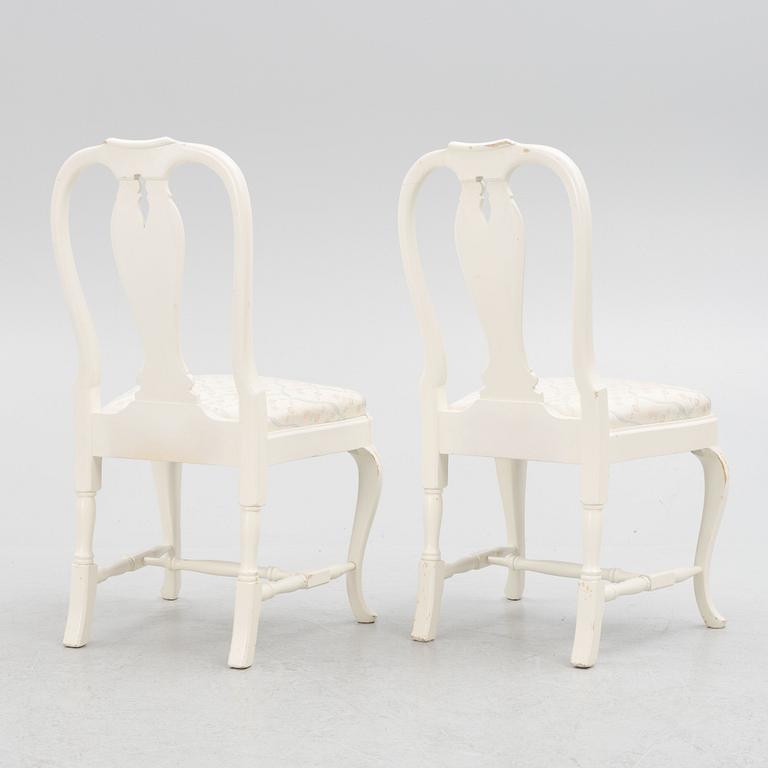 A Rococo style dining table with eight chairs, second half of the 20th century.